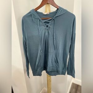 Teal long sleeve tee with hood.